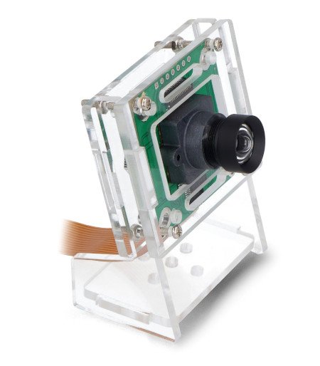 Kamerový modul pro Raspberry Pi s průhledným stojánkem stojí na bílém pozadí.